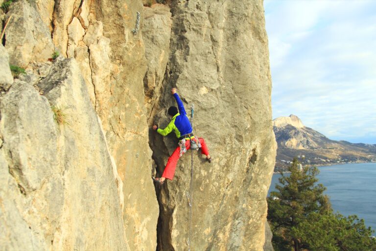A climber partway up a rock face